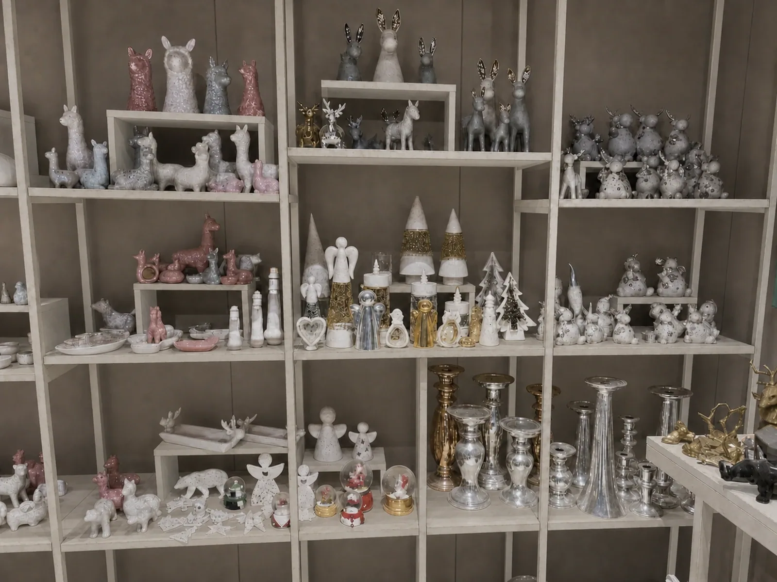 LWTIN ceramic finish and sample library on champagne metal and glass shelving